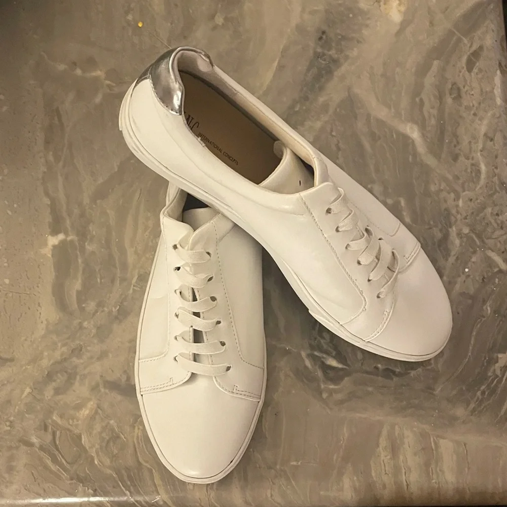 INC Lola Sneakers in the classic White and Silver colorway. Size 10. NWOT